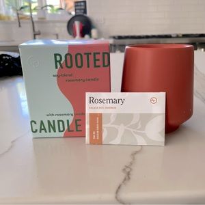 NIB Rooted Rosemary soy candle with pack of Rosemary seeds in terracotta pot.